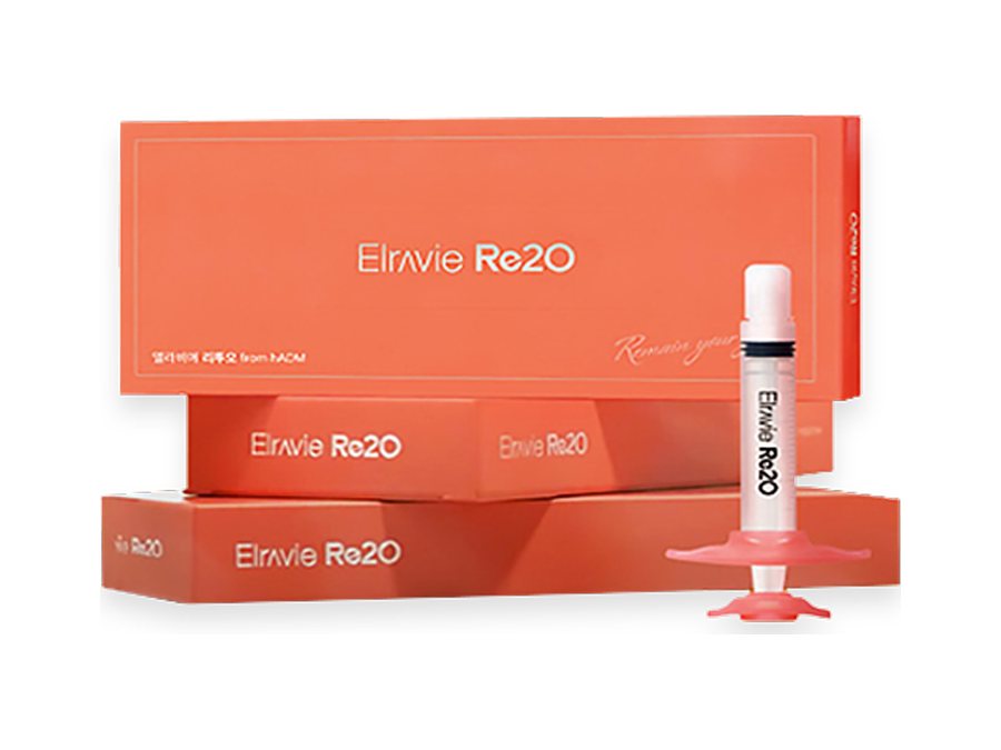 ثلاث علب من Elravie Rituo مكدّسة فوق بعضها مع محقنة