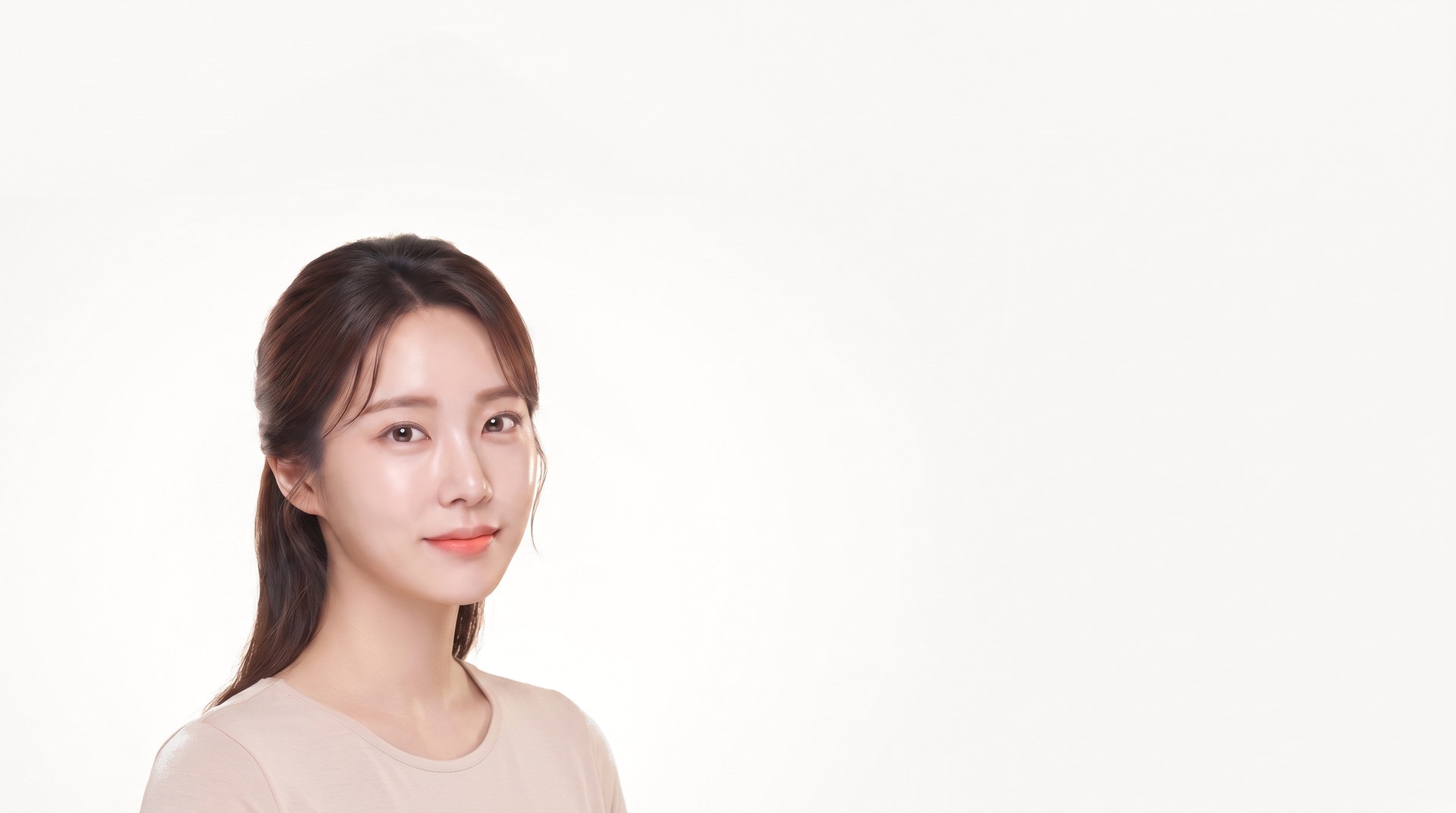Female model facing forward against a background fading from soft mint to ivory