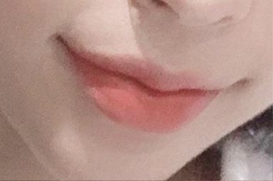Close-up of lips with light pink lip color