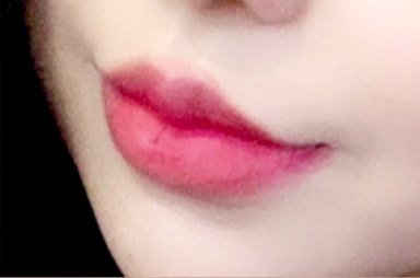 Close-up of lips with deep pink lip color