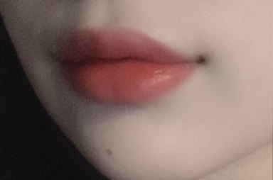 Close-up of full pink lips