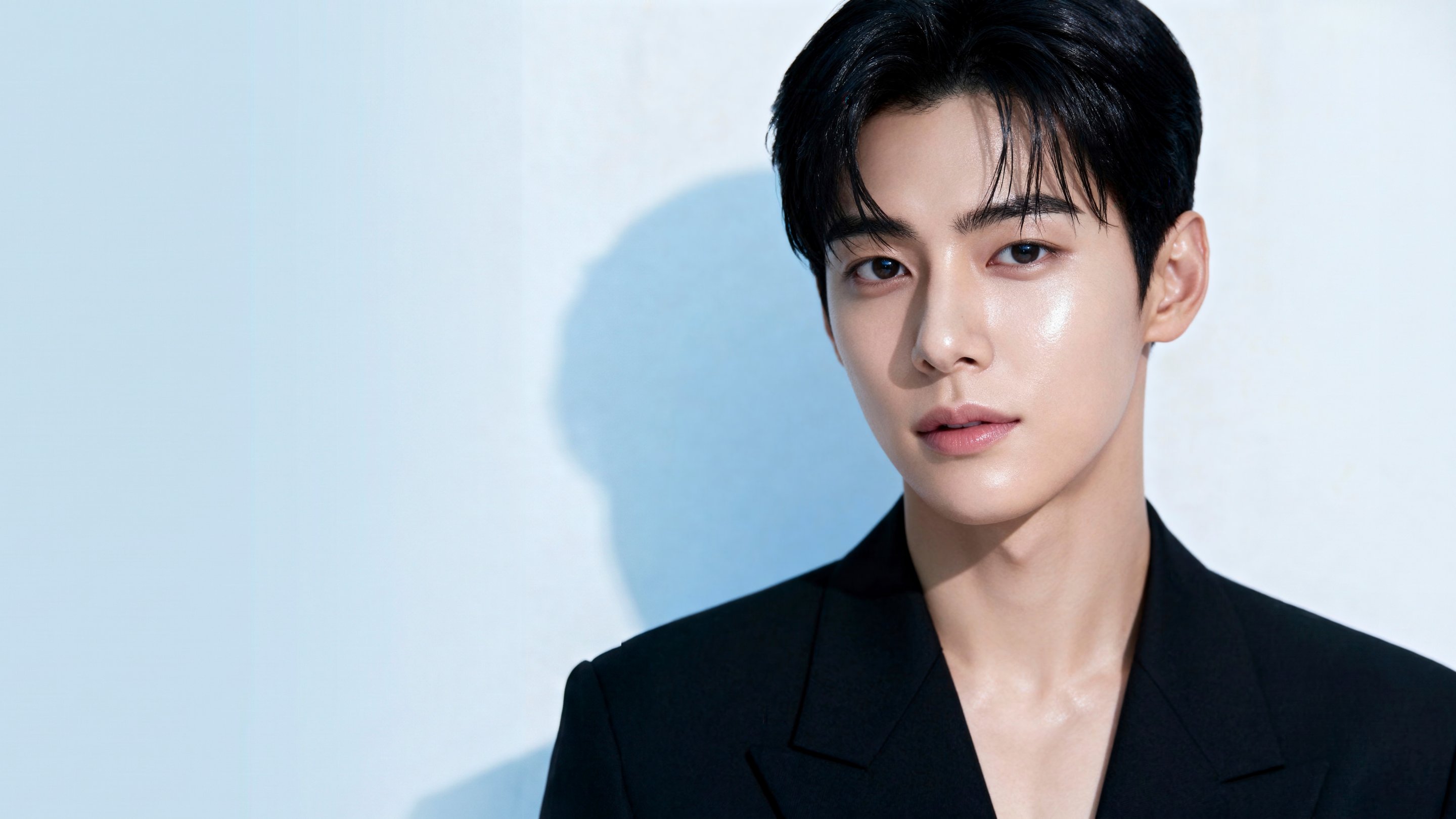 Male model in a black suit — gynecomastia